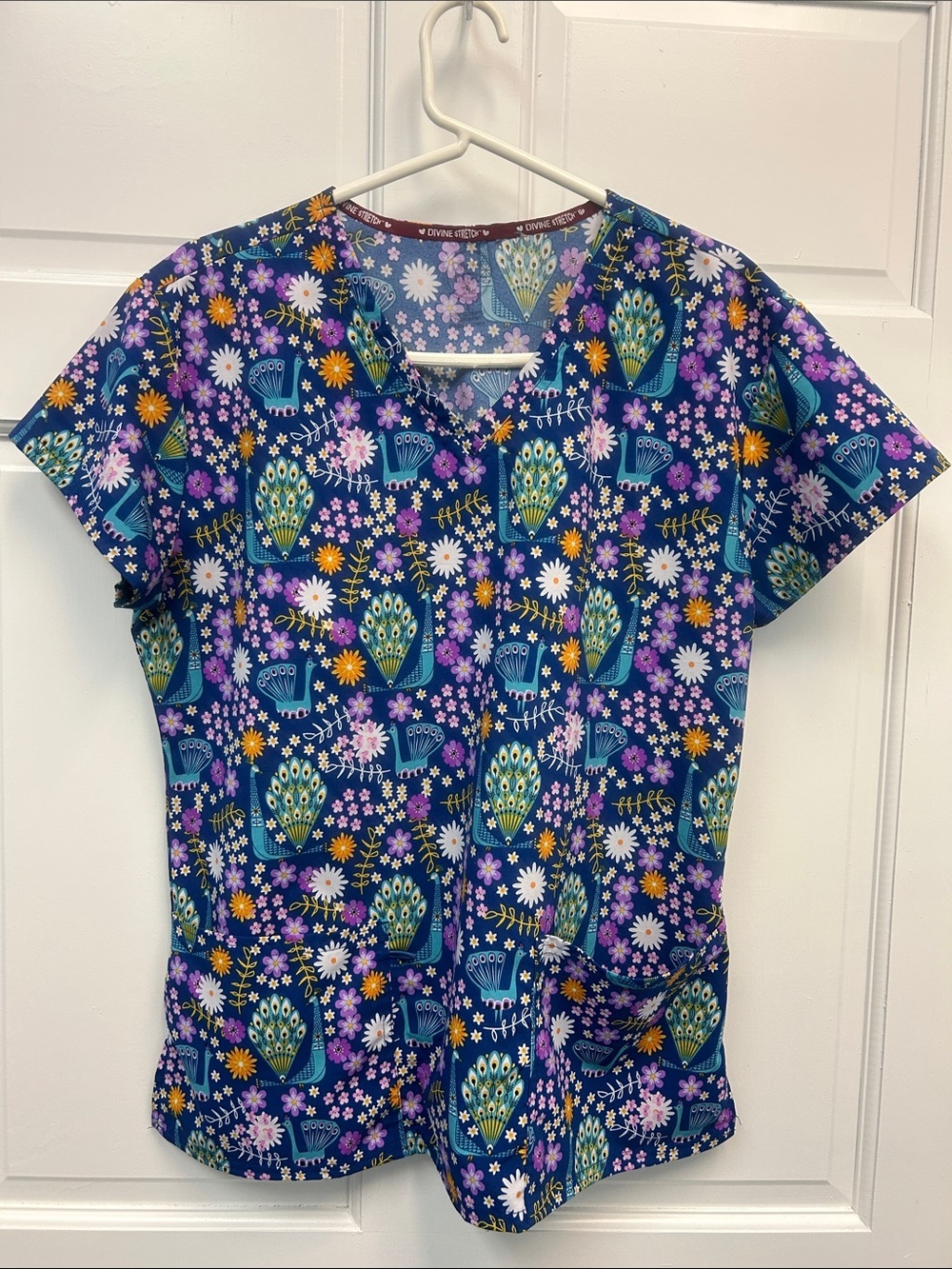 Divine Stretch by JDM Medical Scrub Top Featuring Vibrant Peacocks and Floral